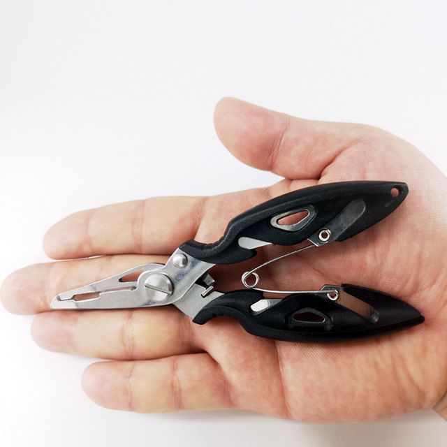A pair of black curved nose pliers held in a hand