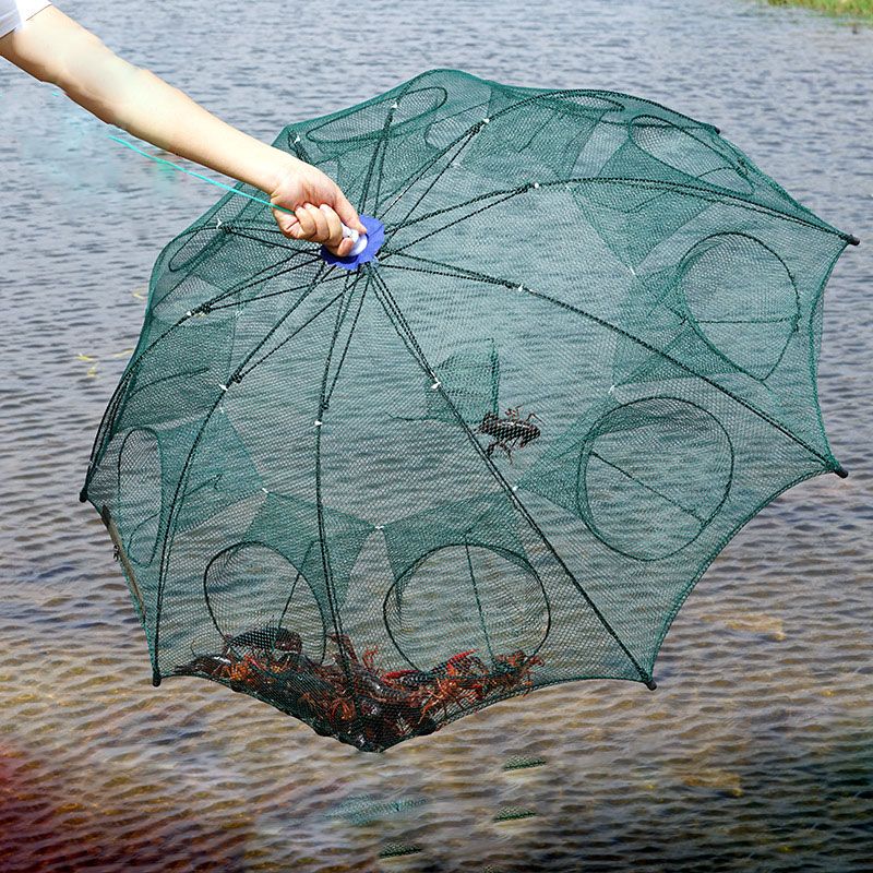 An umbrella-style fishing net held up by its centre above the water