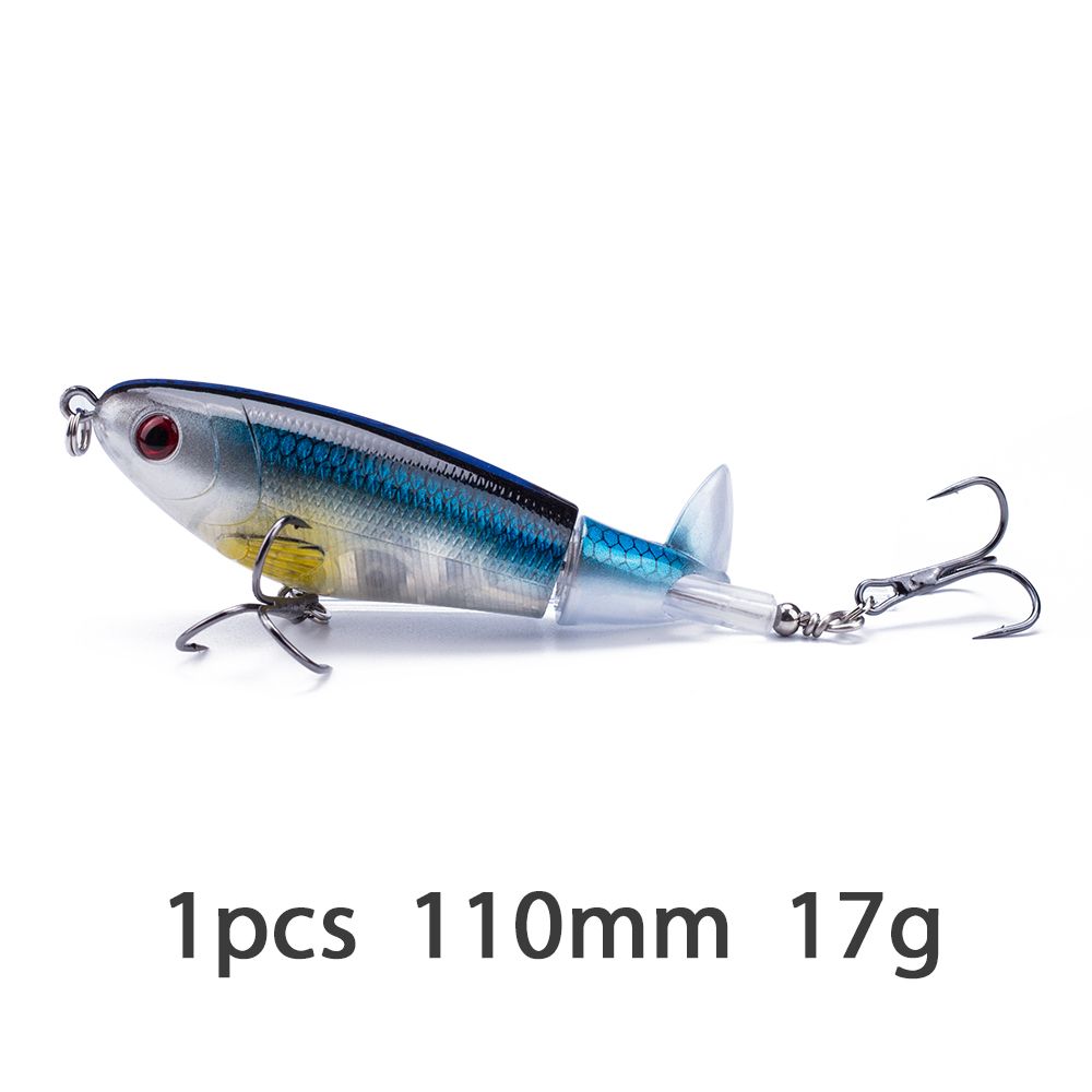 A blue and silver jointed topwater lure with a propeller tail